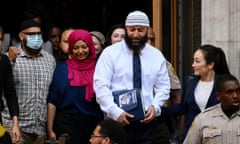 FILE - Adnan Syed, center right, leaves the courthouse after a hearing on Sept. 19, 2022, in Baltimore. A Maryland court did not give the family of the murder victim in the case chronicled in the hit podcast “Serial” enough time to attend a court hearing in person that led to Syed's release, a Maryland appellate court ruled Tuesday, March 28, and it ordered a new hearing to be held. (Jerry Jackson/The Baltimore Sun via AP, File)