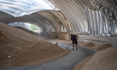 Ukrainians Clean Up After Russian Rocket Attacks On Grain Stores Near Odesa<br>ODESA, UKRAINE - JULY 24: Sunlight coming through shrapnel holes in the roof dapples piles of barley, as Ukrainians salvage barley and peas three days after five Russian missiles struck a grain storage facility in the village of Pavlivka, Odesa region, Ukraine, on July 24, 2023. Russian missile and drone strikes have targeted port and grain storage facilities across the Odesa region for a seven days, after Moscow withdrew after a year from the Black Sea Grain Initiative, which was negotiated by the United Nations and Turkey, and enabled Ukraine to export grain and foodstuffs past a Russian naval blockade. (Photo by Scott Peterson/Getty Images)