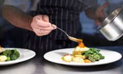 Chef preparing dish in kitchen