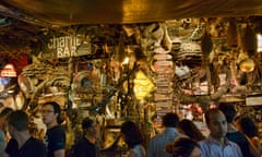 Patrons at a busy Cheap Charlie's bar in Bangkok. The bar was among 10 to close in the city in March.