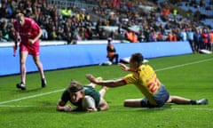 Campbell Graham of Australia goes over for his hat-trick try against Scotland at the Coventry Building Society Arena.