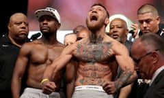 Floyd Mayweather Jr. v Conor McGregor - Weigh-in<br>LAS VEGAS, NV - AUGUST 25:  UFC lightweight champion Conor McGregor (R) screams after the face off with Floyd Mayweather Jr. during their official weigh-in at T-Mobile Arena on August 25, 2017 in Las Vegas, Nevada. The two will meet in a super welterweight boxing match at T-Mobile Arena on August 26.  (Photo by Christian Petersen/Getty Images)