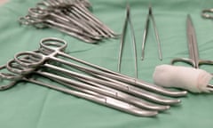 Surgical equipment on a tray covered in a green fabric in a hospital