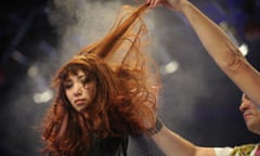 A model has her hair styled on stage at the Informa-run China Beauty Expo in Shanghai in 2012.