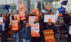 Junior doctors on strike outside University College hospital holding placards