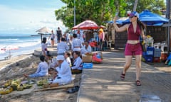 A foreign tourist at a beach in Kuta, Bali.