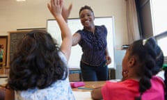 Teacher 'high fiving' student