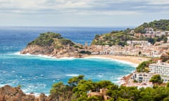 View of the castle, beach and town of Tossa de Mar, Costa Bravo, Spain on a sunny day.