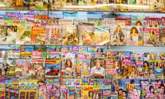 Magazines for sale on a shelf in a newsagent shop store in the Uk<br>DDTD0X Magazines for sale on a shelf in a newsagent shop store in the Uk