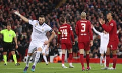 Karim Benzema celebrates scoring as Liverpool players reacted in dismay at Anfield