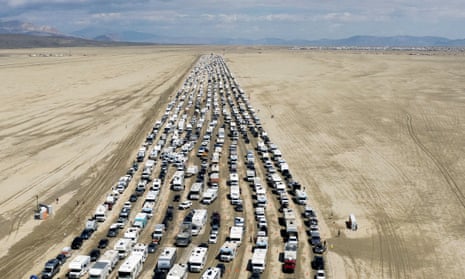 Drone footage shows vehicles leaving Burning Man festival after days stranded in thick mud – video