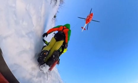 Mountaineers stranded on icy gully in Italian Alps rescued by helicopter – video