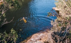 A swimmer in the middle of Jellybean Pool in the Blue Mountains