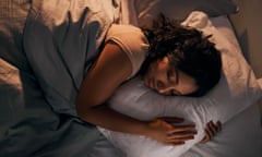 Posed by model young woman sleeping in her bed