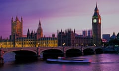 The Houses of Parliament and river boat in twilight