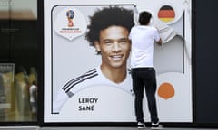 A promotional World Cup poster of Leroy Sane is taken off the wall of the German football museum in Dortmund, Germany.