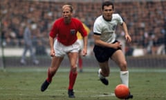 Franz Beckenbauer dribbles away from Bobby Charlton during the 1966 World Cup final