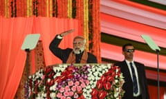 India’s prime minister, Narendra Modi, speaks at a rally in Srinagar, watched over by his bodyguard.