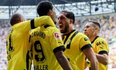 Borussia Dortmund players including Emre Can celebrate Sébastien Haller’s opener in Augsburg