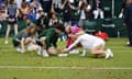 Assistants clean grass tennis court