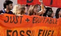 Activists stage a protest against fossil fuels at the Cop28 climate summit in Dubai on 13 December.