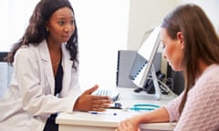 Female Doctor Treating Patient