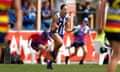 Jasmine Garner pumps her fists in celebration during the preliminary final against the Crows