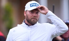 Daniel Brown adjusting his hat on the 18th hole during day one of the Open Championship