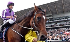 The busy Doncaster crowd is seen behind the St Leger winners, Kew Gardens and Ryan Moore.