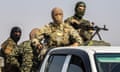 SYRIA-TURKEY-CONFLICT-KURDS<br>Fighters from the Syrian Democratic Forces (IDF) gather in their military vehicles as they withdraw from the Sanjak Saadoun border area near the northern Syrian town of Amuda, on October 27, 2019. - Kurdish forces today said they will redeploy away from the entire length of Syria’s nothern border in compliance with a Russian-Turkish agreement that will see them replaced by Damascus-backed forces. (Photo by Delil SOULEIMAN / AFP) (Photo by DELIL SOULEIMAN/AFP via Getty Images)