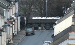 Disposal experts remove the bomb from the scene at St Michael Avenue on the back of a specialised vehicle