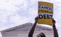 People advocate for the cancellation of student debt outside the US supreme court in Washington DC on 30 June. 