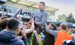Rob Edwards gets a lift as Forest Green celebrate at Bristol Rovers after winning promotion to League One.