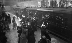 Soldiers waving good bye to loved ones as they leave Victoria Station, London, 1915