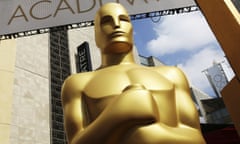 FILE - In this Feb. 21, 2015 file photo, an Oscar statue appears outside the Dolby Theatre for the 87th Academy Awards in Los Angeles. (Photo by Matt Sayles/Invision/AP, File)