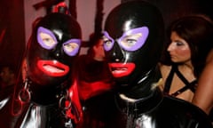 Two people in rubber masks