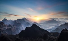 Aerial view of misty mountains at sunrise