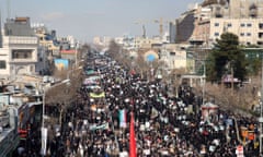 Iranian pro-government supporters march in Mashhad