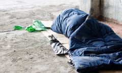 Homeless man sleeping in sleeping bag on cardboard. Image shot 2008. Exact date unknown.<br>BAXX1B Homeless man sleeping in sleeping bag on cardboard. Image shot 2008. Exact date unknown.
