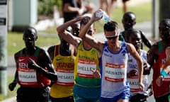 Callum Hawkins pours water over his head to rehydrate