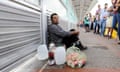 Ruben Prado, an immigrant from Guatemala seeking asylum in the US, waits on the Gateway International Bridge. 