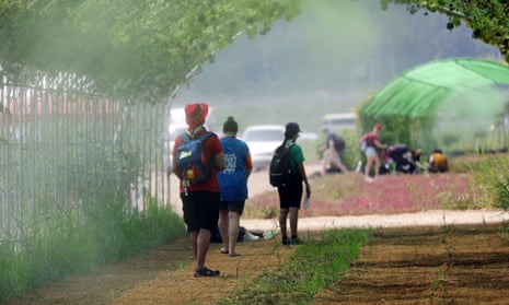 Hundreds fall ill from heat at World Scout Jamboree in South Korea – video