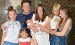 Jamie and Jools Oliver with their children, the older two of whom were present at the birth of their new baby brother this week.