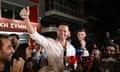 Stefanos Kasselakis waves to supporters outside the party's headquarters