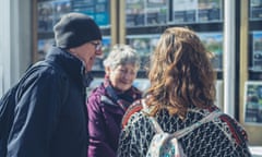 A senior couple and their adult daughter are looking at an estate agents window<br>MY6PWP A senior couple and their adult daughter are looking at an estate agents window