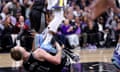 Golden State Warriors' Draymond Green lands on Domantas Sabonis during his team’s loss to the Sacramento Kings