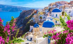 Traditional white houses and churches with blue domes.