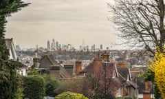 Street of house rooftops in Wimbledon with view of the City of London- south west London - UK<br>2BE5A99 Street of house rooftops in Wimbledon with view of the City of London- south west London - UK