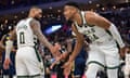 Milwaukee Bucks forward Giannis Antetokounmpo (34) celebrates with guard Damian Lillard (0) after scoring a basket in the fourth quarter against the Indiana Pacers at Fiserv Forum on Wednesday night.