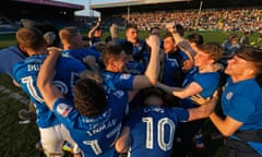 Rochdale players celebrate after avoiding relegation with a 1-0 win over Charlton.